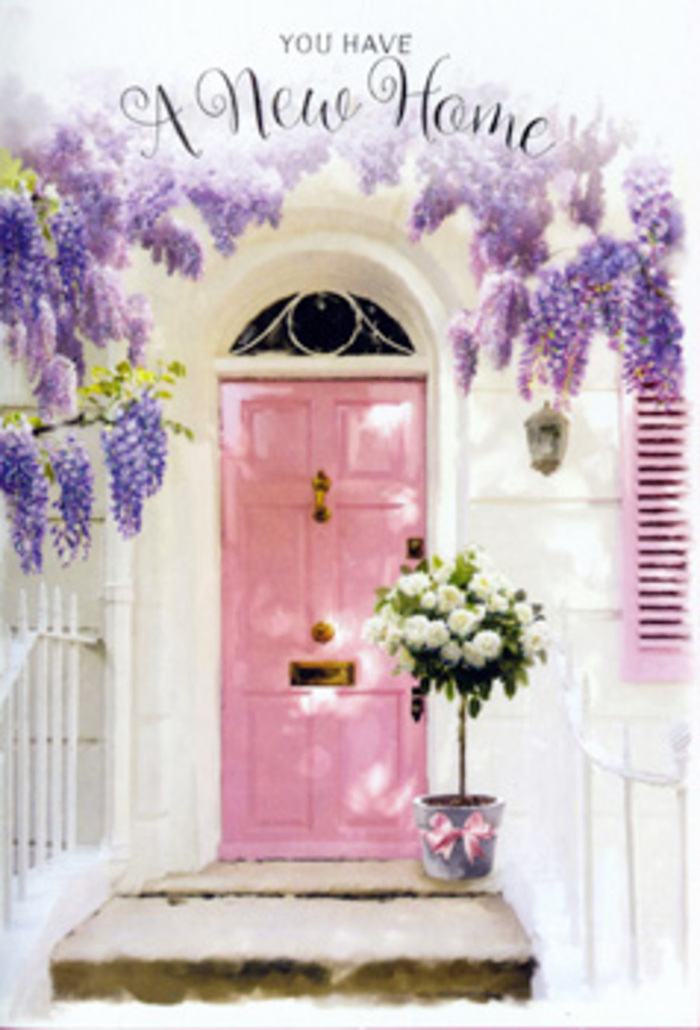 An inviting Ruislip doorway is transformed into a floral daydream in this detailed scene. The eye is immediately drawn to a pink front door, painted in a flattering, slightly muted blush that strikes a perfect balance between playful and sophisticated. It stands comfortably against whitewashed walls, with a softly coloured shutter nearby that catches the same mild light, as if reflecting a calm afternoon over Ruislip Woods. Overhead and to the sides, profuse wisteria blooms pour downward, their lavender-toned flowers grouped in dangling clusters that form a loose, fragrant canopy. The wisteria's tendrils soften the edges of the doorway, giving the entrance the feel of a secret hideaway or a cottage retreat just off Victoria Road. At the base of the door, right where a welcome mat might sit, a metal florist's bucket has been placed with deliberate care. The bucket is filled with lush white and cream roses, each bloom fully open, petals layered in soft spirals that feel almost touchable. Here and there, sprigs of fresh greenery rise among the roses, offering hints of soft texture and subtle contrast. A pink ribbon circles the base of the bucket, tied in a neat bow that mirrors the tone of the door and provides a finishing flourish. Light drifts gently across the scene, creating delicate shadows along the steps and highlighting the grain of the wood and the curve of each petal. The overall effect is tender and optimistic, suggesting the thrill and slight flutter of nerves that come with a new house key in hand. It feels like the kind of thoughtfully arranged housewarming display a Ruislip florist might deliver to mark a move with grace, warmth, and the quiet promise of belonging.