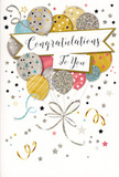 The scene shows a beautifully designed congratulations card that captures the essence of a joyful yet refined celebration, much like marking exam results or a promotion with flowers in Ruislip. The card front is almost entirely taken up by an arrangement of illustrated balloons, gathered in a loose, rounded cluster that appears to float upwards from the lower half of the design. The balloons come in a palette of soft metallic gold, cool silver, champagne cream, baby blue, blush pink and pale grey, each rendered with subtle shading to suggest gentle curves and volume. Many are adorned with tiny, twinkling stars, delicate stripes or fine speckles of glittery ink, so they seem to shimmer even in stillness. Slender ribbons in muted gold and silver descend from the base of the cluster, curling and looping down the card like the trailing tails of real balloon strings resting on a table in a Ruislip living room. Threading through the centre is a smooth banner, lightly curved and gently overlapping the balloons, carrying the message Congratulations To You written in graceful, flowing script that gives the card its warm, sincere voice. Surrounding the main motif, the pale background is sprinkled with small metallic stars, swirling flourishes and confetti-like dots, creating the feeling of movement and a soft burst of festivity. The design strikes a balance between sparkle and subtlety, making it perfect to accompany a fresh bouquet delivered across Ruislip, Eastcote or Hillingdon whenever someone's achievement calls for something more thoughtful than a quick text or email.